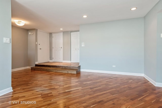 unfurnished room featuring hardwood / wood-style flooring