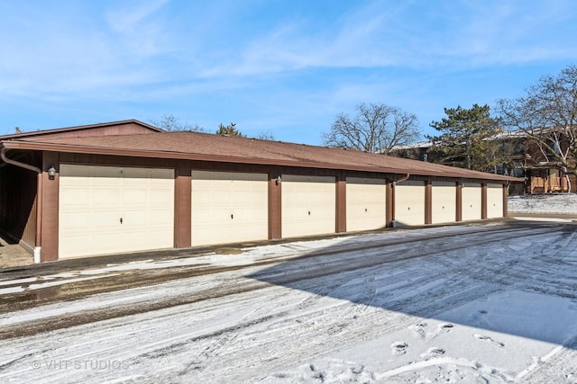 view of snow covered garage