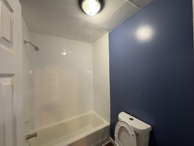 bathroom with toilet and shower / tub combination