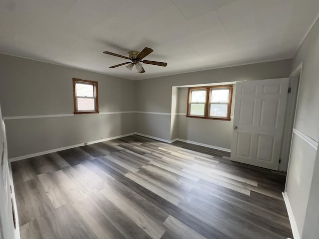 unfurnished room with hardwood / wood-style flooring and ceiling fan