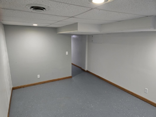 basement featuring a drop ceiling