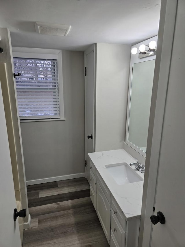 bathroom featuring vanity and wood-type flooring