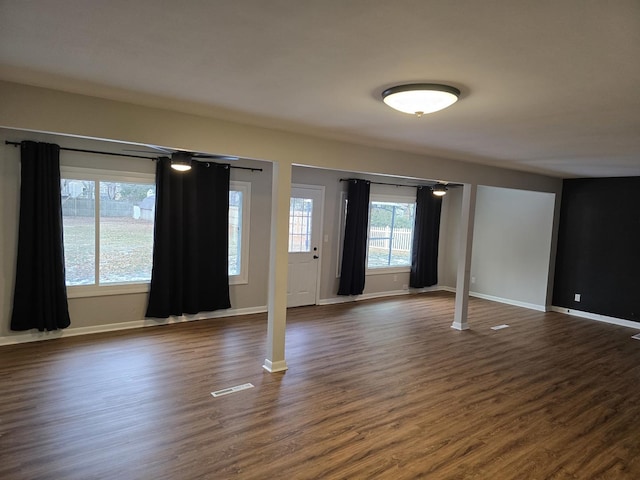 unfurnished room with dark hardwood / wood-style floors