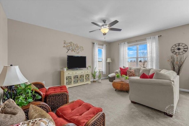 carpeted living room featuring ceiling fan