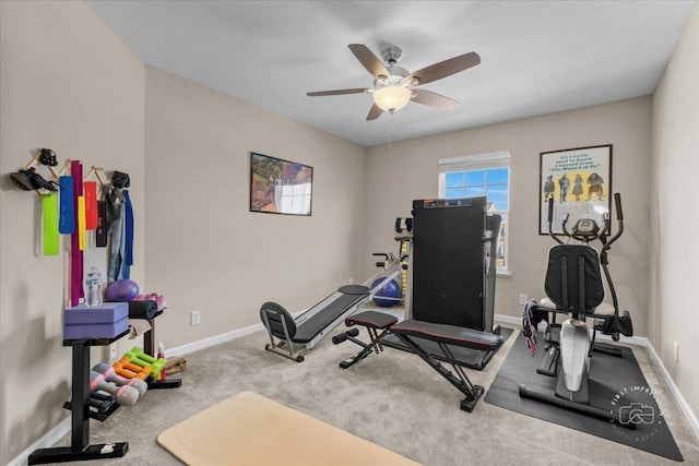 workout area featuring light colored carpet and ceiling fan