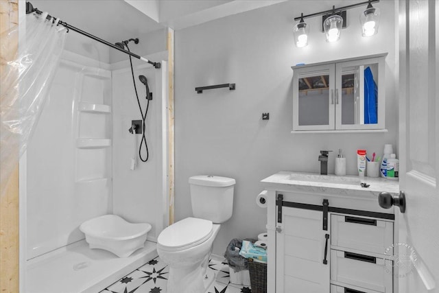 bathroom featuring vanity, curtained shower, and toilet