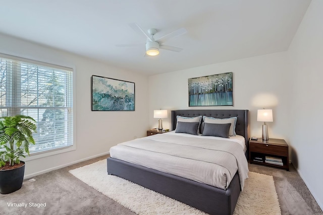 carpeted bedroom featuring ceiling fan