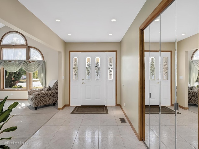 foyer with light tile patterned flooring