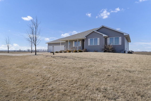 single story home with a front yard and a garage