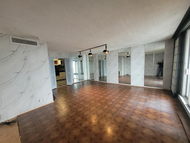 empty room with a textured ceiling