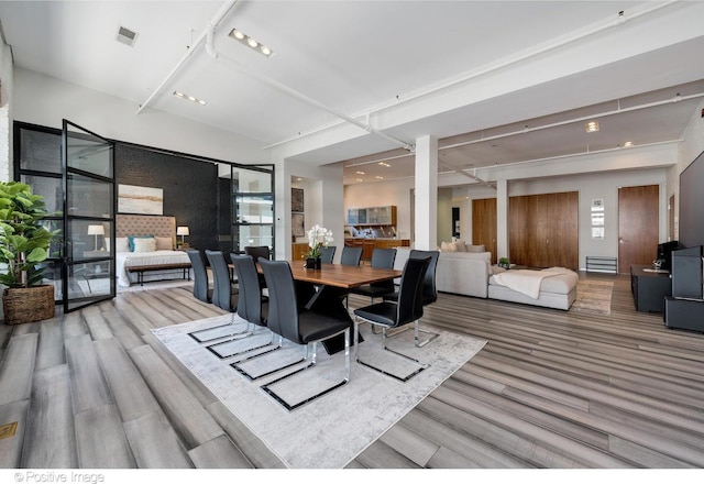 dining area with hardwood / wood-style floors