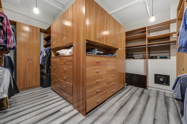 walk in closet featuring light hardwood / wood-style floors