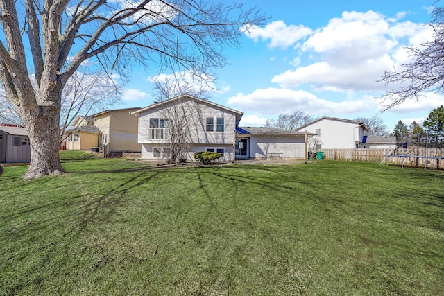 back of property featuring a patio area, a trampoline, fence, and a yard