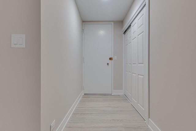 corridor featuring light hardwood / wood-style floors