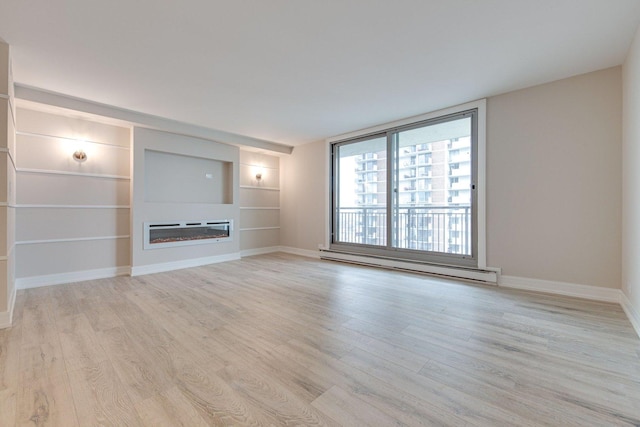 unfurnished living room with baseboard heating, built in features, and light hardwood / wood-style floors