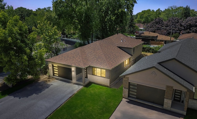 view of front of house with a front lawn and a garage