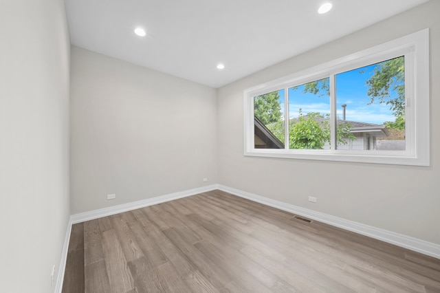 unfurnished room featuring light hardwood / wood-style flooring