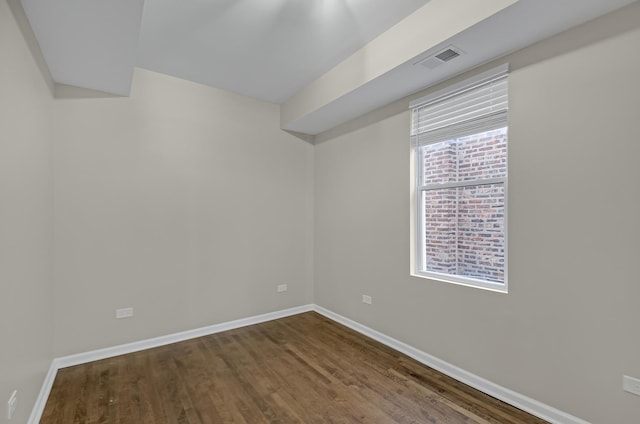 empty room with hardwood / wood-style floors