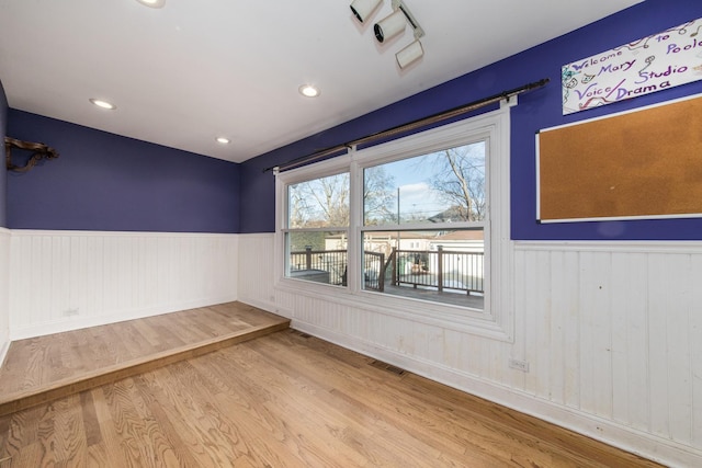 spare room with light wood-type flooring