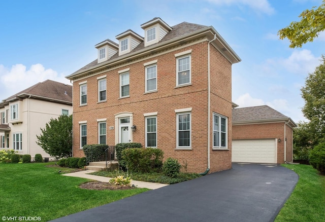 view of front of house featuring a garage and a front yard