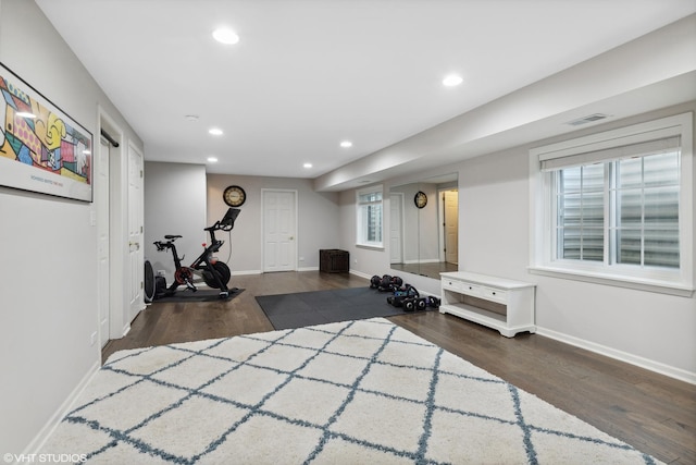 workout room with dark hardwood / wood-style floors