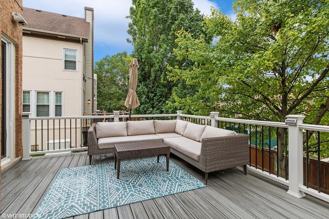 wooden deck with an outdoor living space