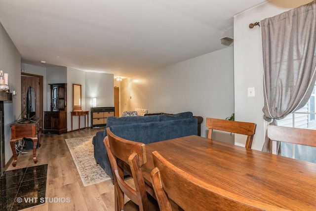 dining area with light hardwood / wood-style flooring