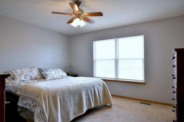 carpeted bedroom with ceiling fan