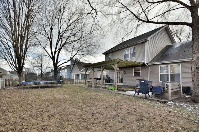 view of yard with a patio, central AC, a trampoline, and a pergola