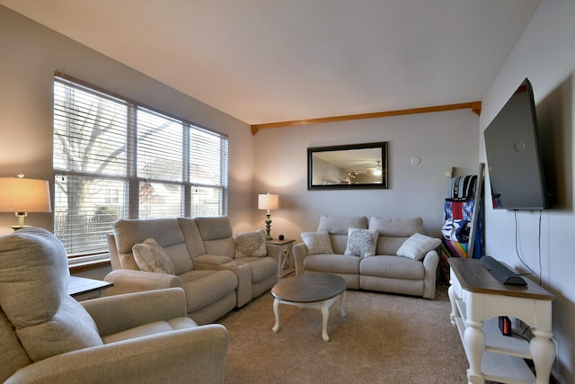 living room featuring carpet and vaulted ceiling with beams