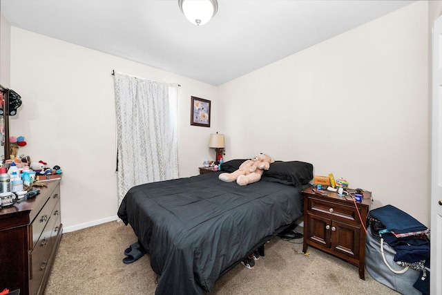 bedroom featuring light colored carpet