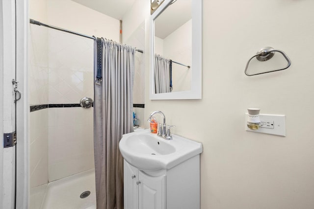 bathroom with vanity and walk in shower