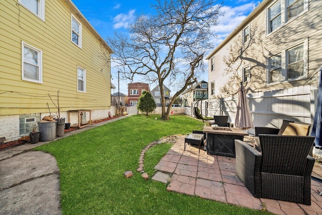 view of yard featuring a patio area and a fire pit