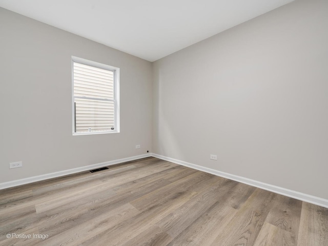 unfurnished room featuring light wood-type flooring