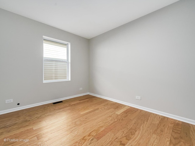 empty room with light hardwood / wood-style floors