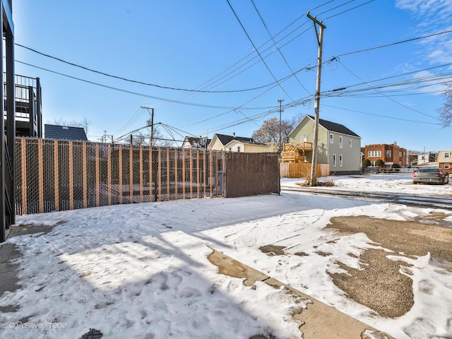 view of yard layered in snow