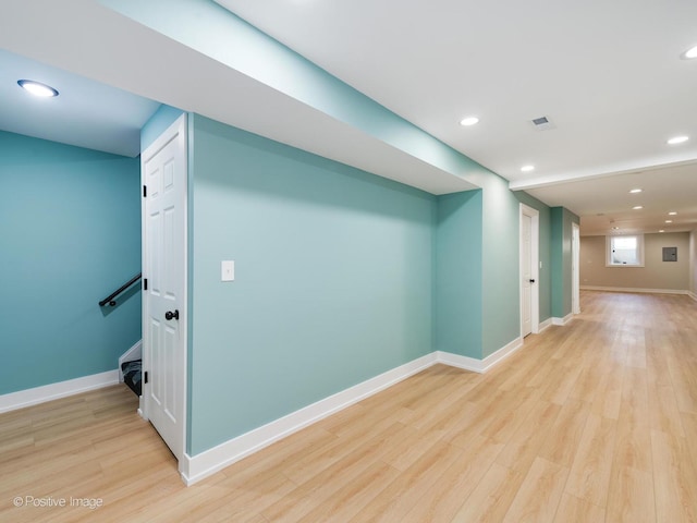 basement featuring light hardwood / wood-style flooring