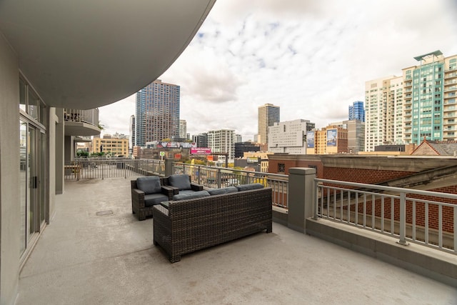 view of patio with an outdoor hangout area and a balcony