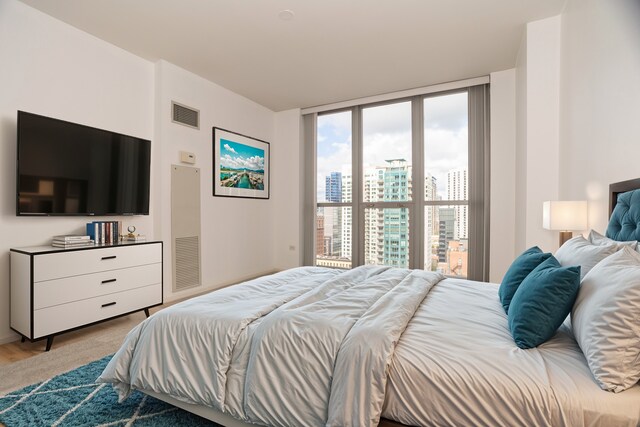 bedroom with floor to ceiling windows