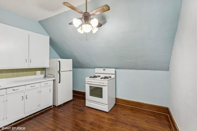 kitchen featuring white cabinetry, white appliances, dark hardwood / wood-style floors, and lofted ceiling