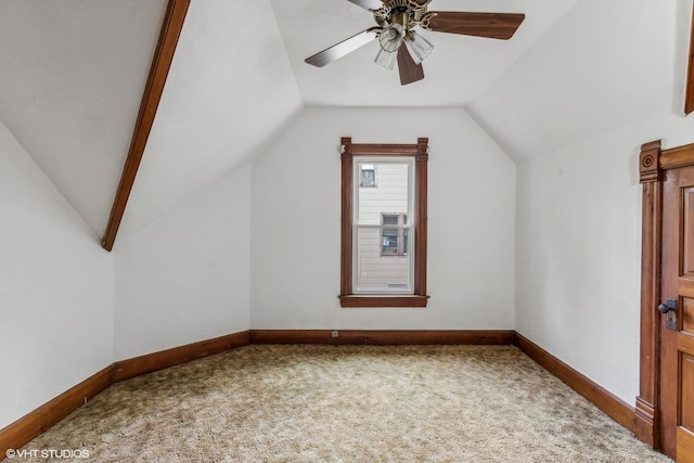 additional living space with ceiling fan, carpet flooring, and lofted ceiling