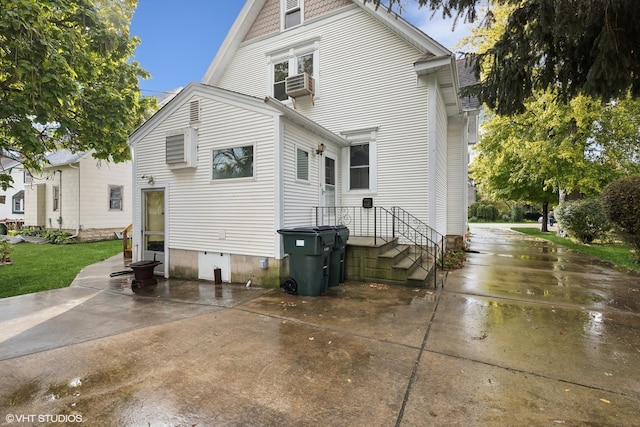 back of house featuring a patio area and cooling unit