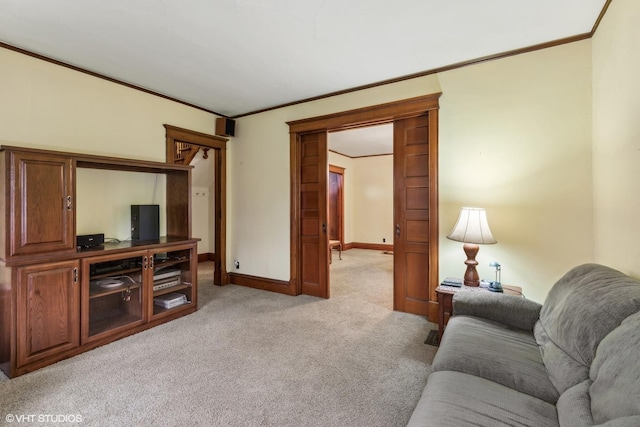 carpeted living room featuring ornamental molding