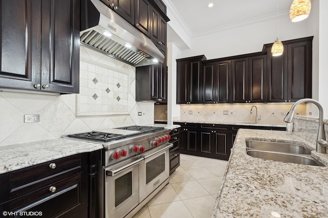 kitchen with decorative light fixtures, crown molding, double oven range, a sink, and exhaust hood