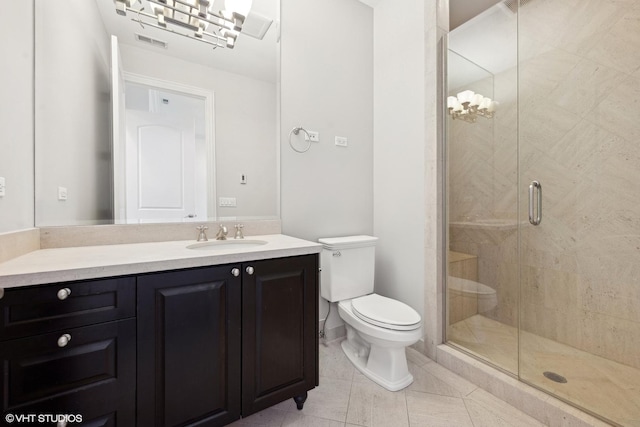 bathroom with visible vents, toilet, a stall shower, vanity, and tile patterned floors