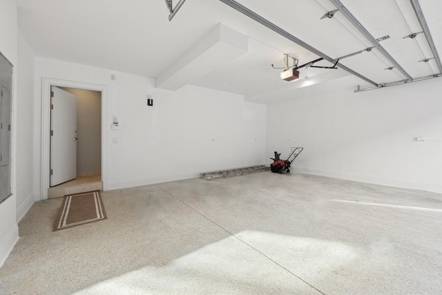 garage with baseboards and a garage door opener