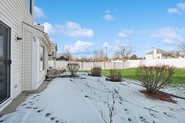 view of yard covered in snow