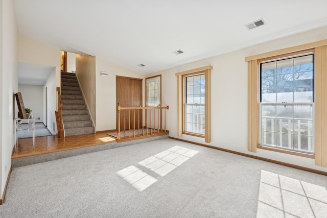 interior space with vaulted ceiling and a wealth of natural light