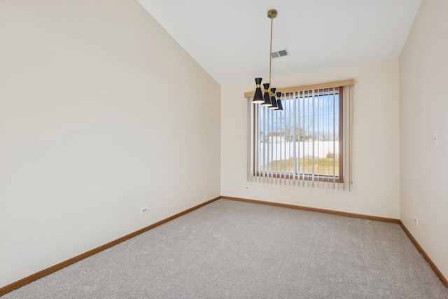 unfurnished room with carpet floors, lofted ceiling, and a notable chandelier