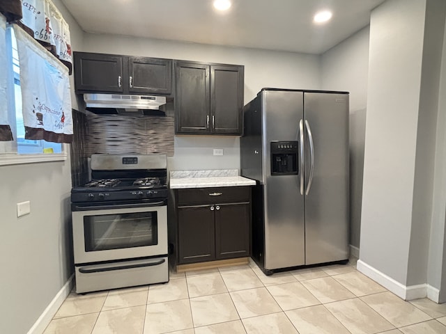 kitchen featuring light tile patterned floors and stainless steel appliances